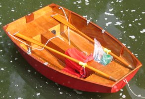 Pram dinghy on the water